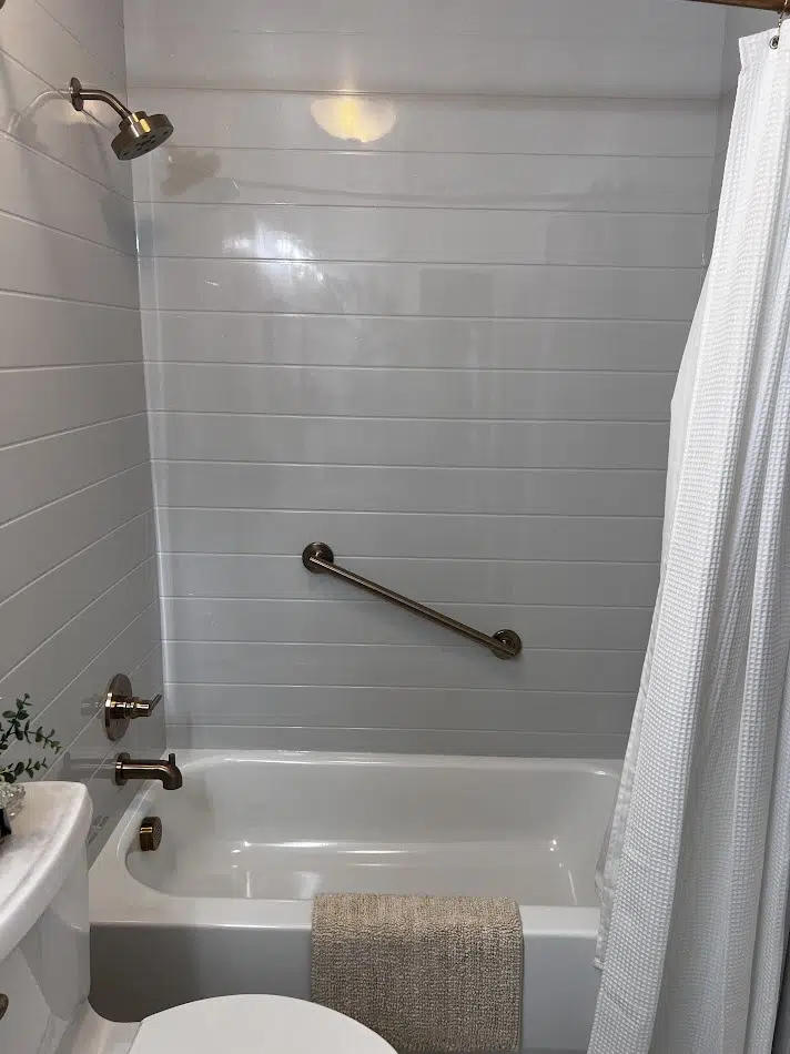 Custom tub surround with Onyx solid-surface wall panels