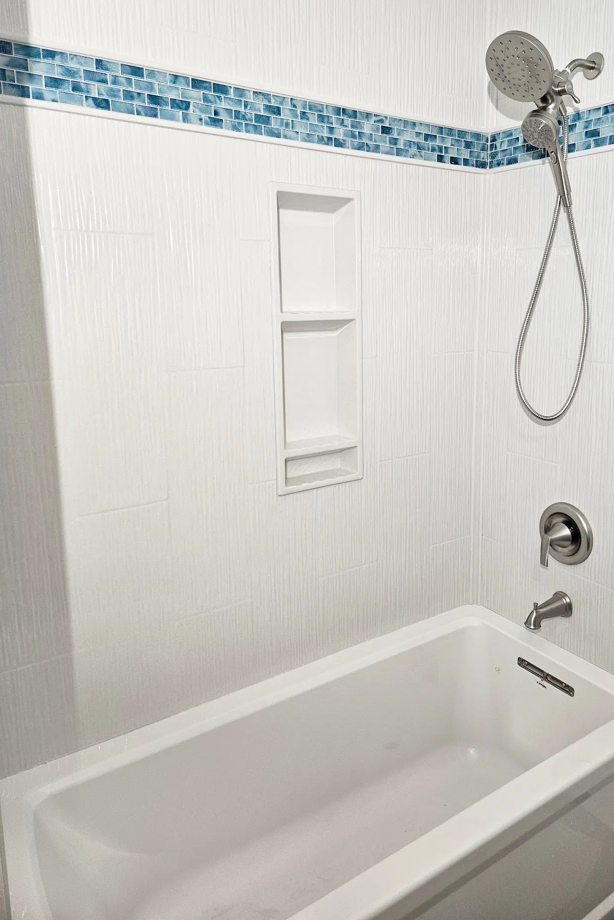Bathroom tub surround update with clean Onyx wall finish