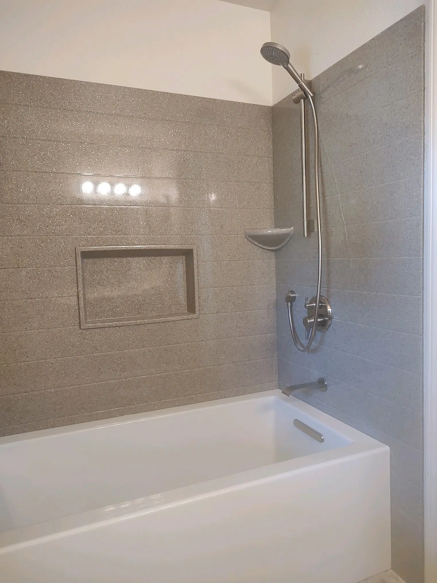 Tub and shower surround installation with low-maintenance Onyx walls