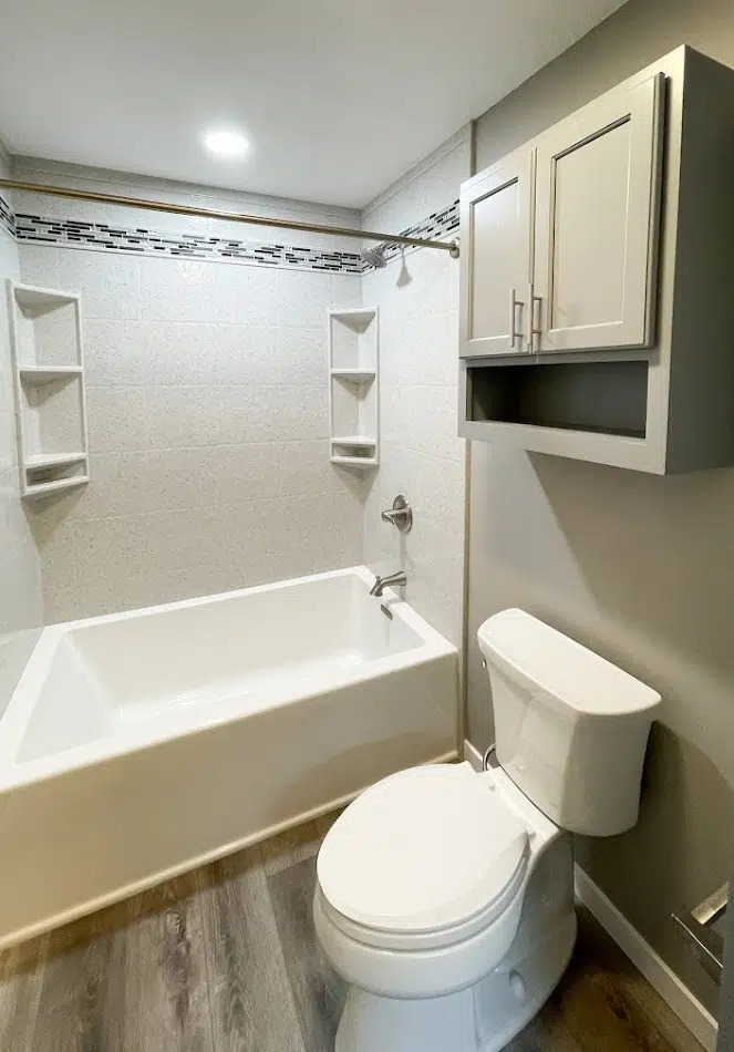 Onyx tub surround remodel with bright white wall panels